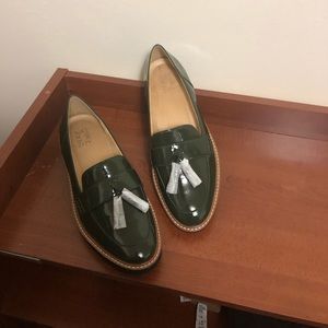 Super cute olive green loafers with tassels.